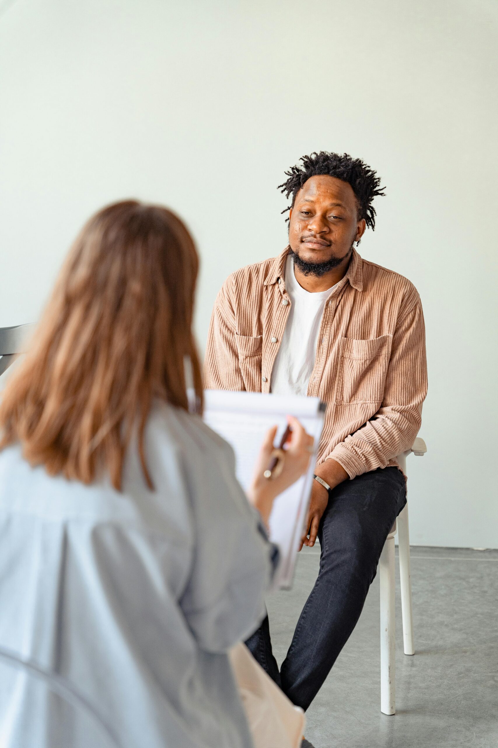 Therapist conducting a one on one therapy session with a patient currently attending drug rehab at My Time Recovery in Fresno, California.
