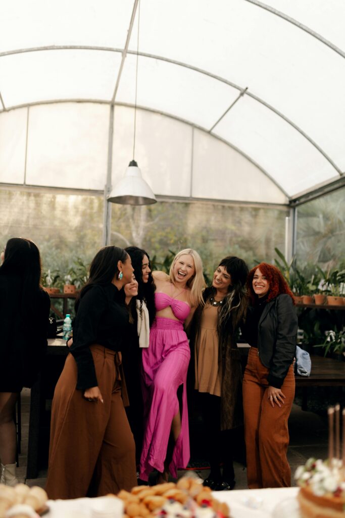 Group of women smiling and supporting each other during drug rehab in Fresno, CA.